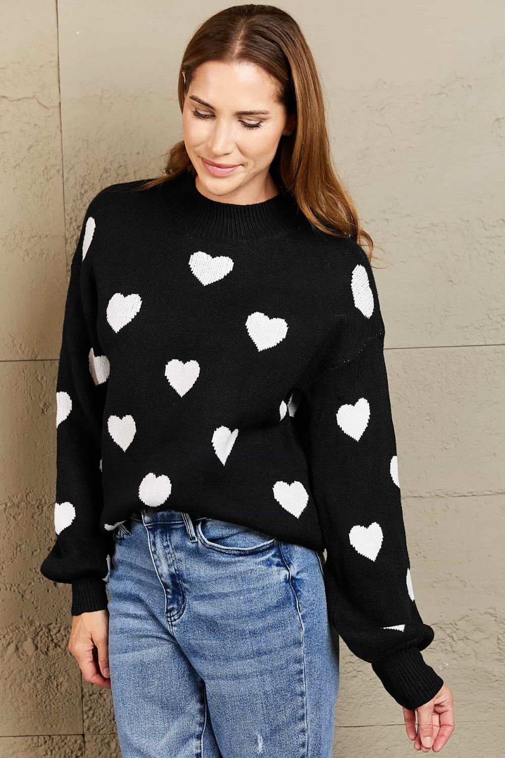 Suéter tipo túnica con cuello redondo y mangas abullonadas con estampado de corazón tejido a la derecha