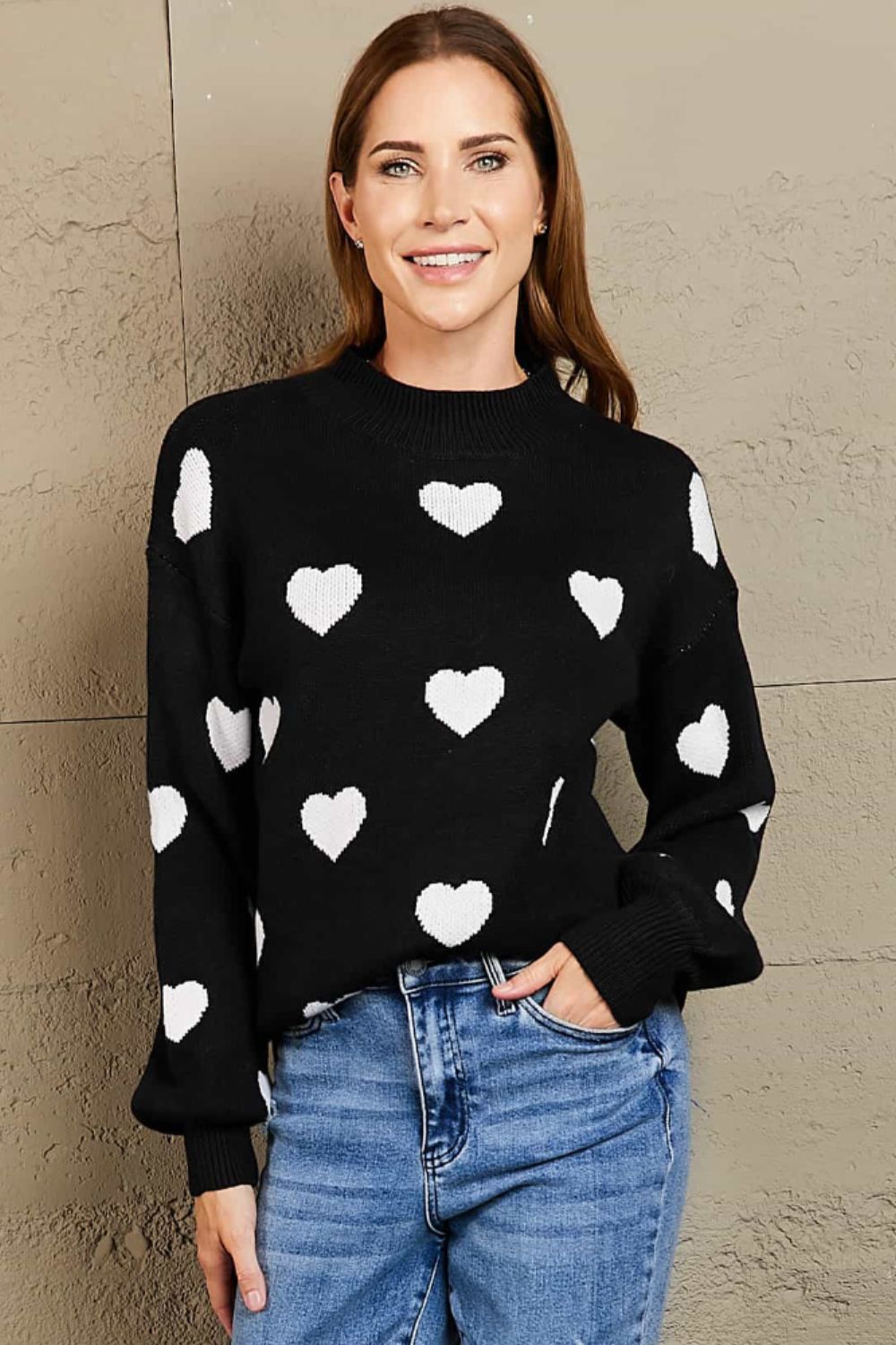 Suéter tipo túnica con cuello redondo y mangas abullonadas con estampado de corazón tejido a la derecha
