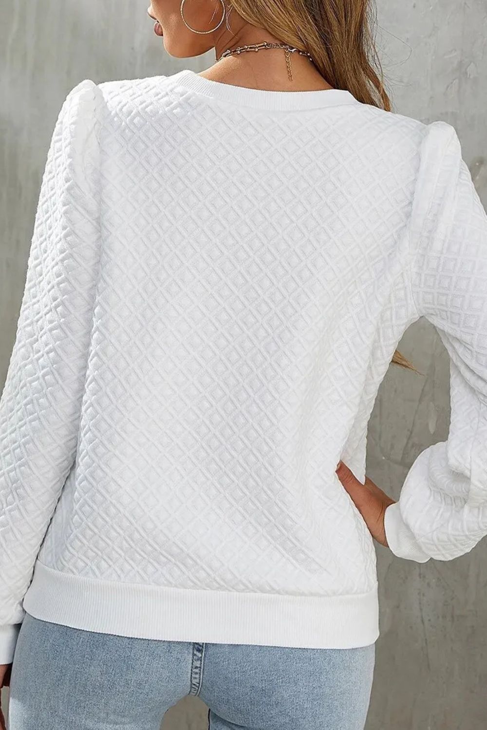 Top de manga larga con cuello redondo y textura