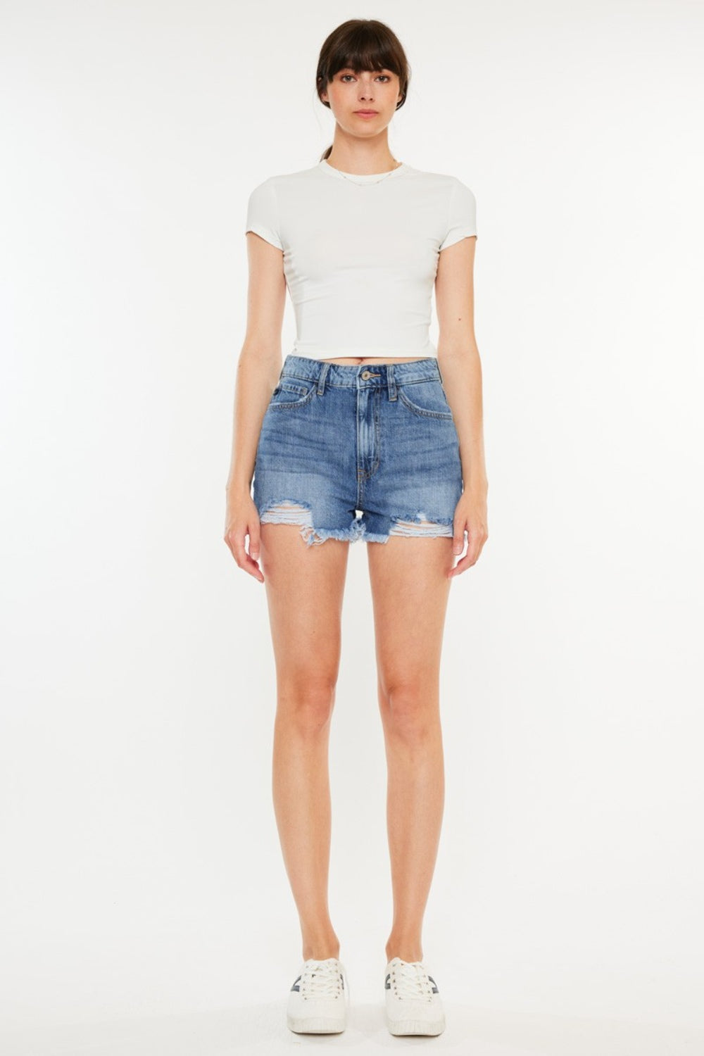 Pantalones cortos de mezclilla de cintura alta con dobladillo sin rematar y desgastado de Kancan