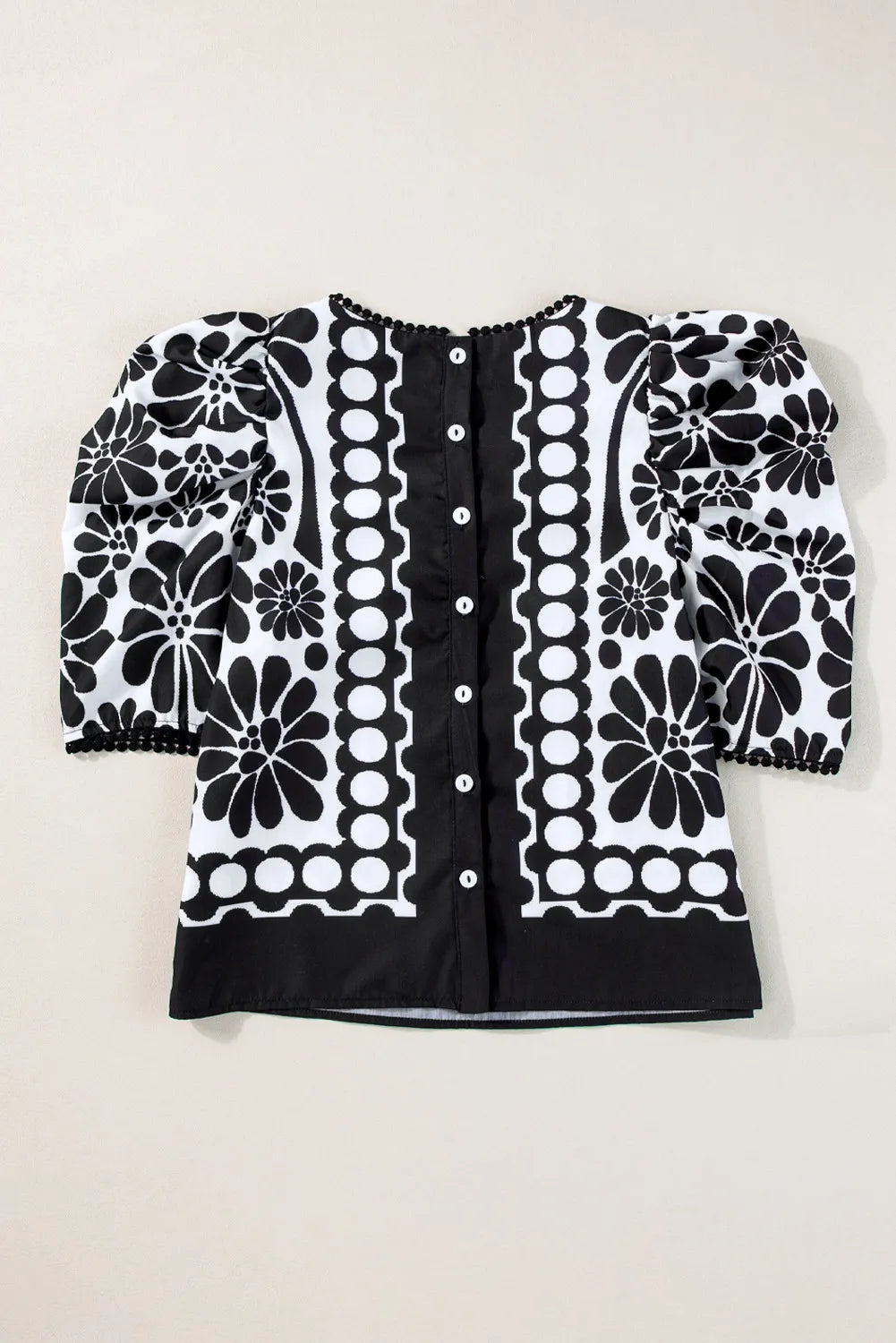 Blusa estampada de cuello redondo y media manga
