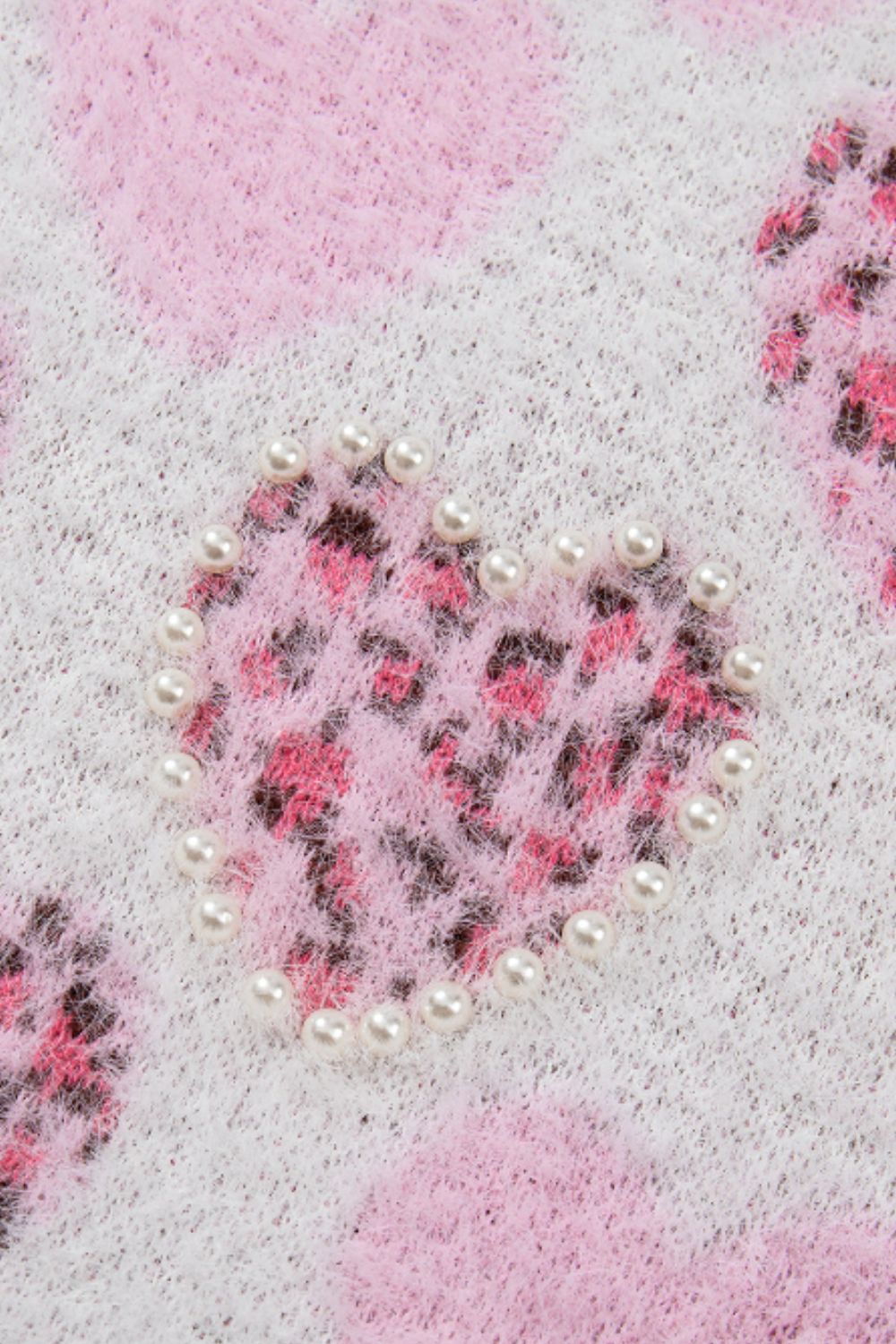 Suéter de cuello redondo con corazón y detalle de perla