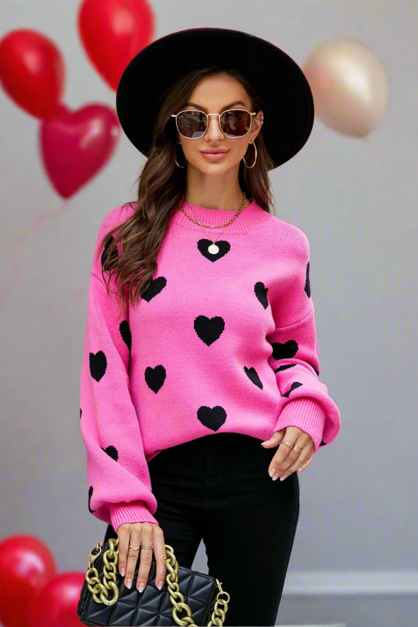 Suéter tipo túnica con cuello redondo y mangas abullonadas con estampado de corazón tejido a la derecha