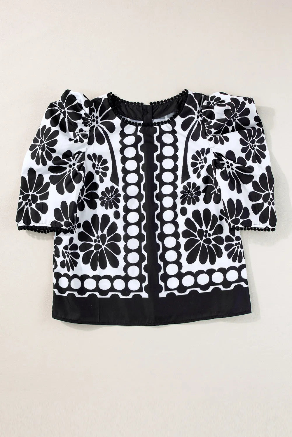 Blusa estampada de cuello redondo y media manga