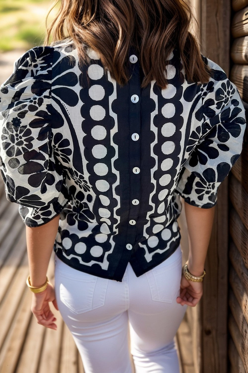 Blusa estampada de cuello redondo y media manga