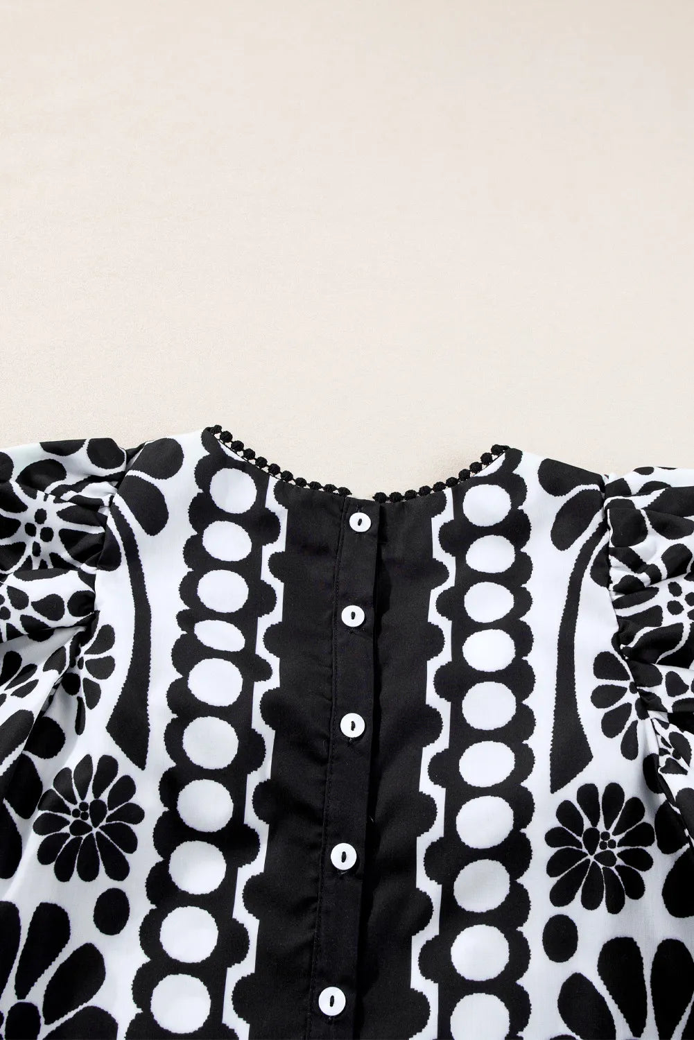 Blusa estampada de cuello redondo y media manga