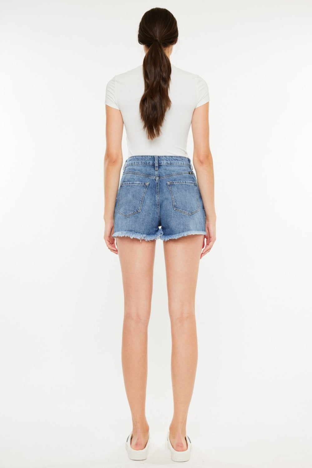 Pantalones cortos de mezclilla de cintura alta con dobladillo sin rematar y desgastado de Kancan