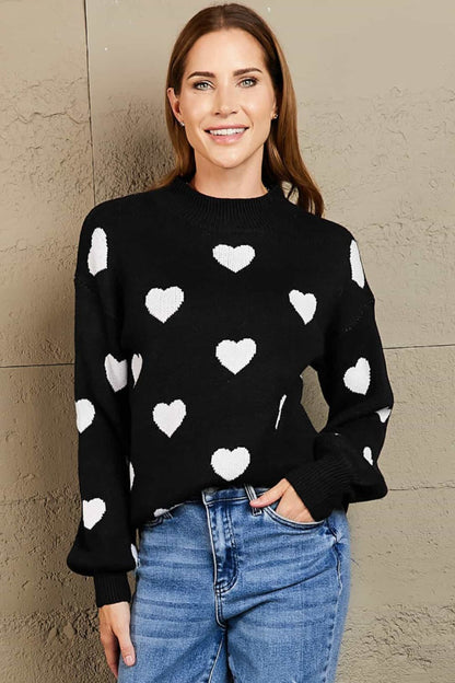 Suéter tipo túnica con cuello redondo y mangas abullonadas con estampado de corazón tejido a la derecha
