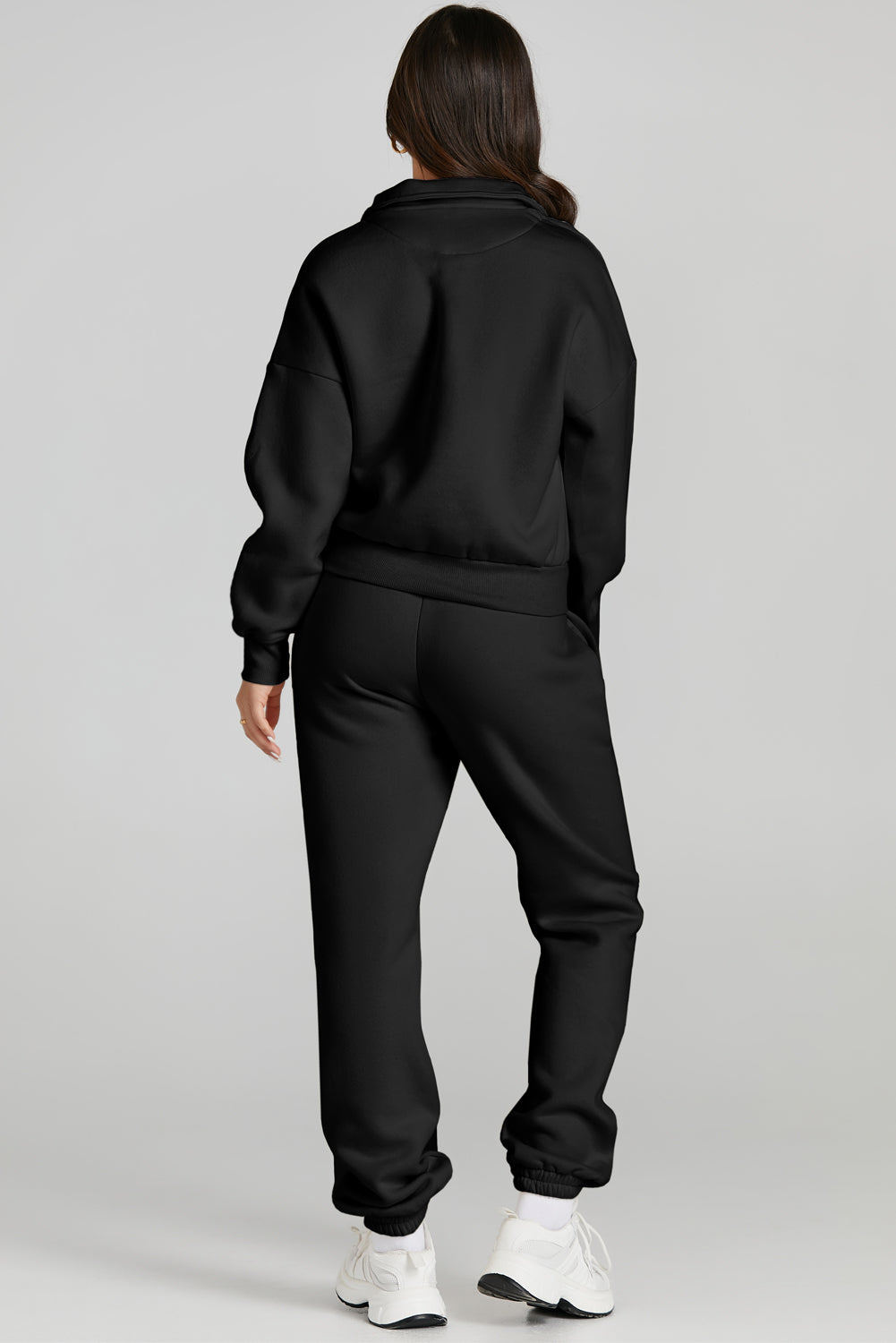 Conjunto deportivo con parte superior con cremallera de un cuarto y pantalón con cordón