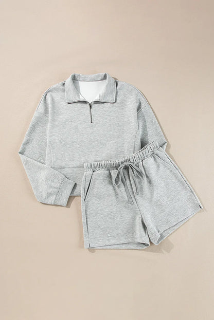 Conjunto de camiseta de manga larga con media cremallera y pantalones cortos con cordón