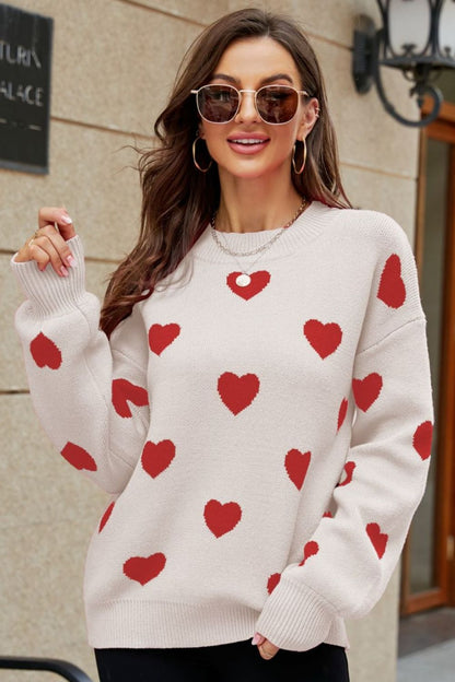 Suéter tipo túnica con cuello redondo y mangas abullonadas con estampado de corazón tejido a la derecha