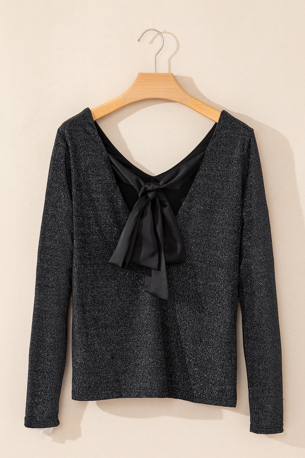 Blusa de manga larga con escote en V y lazo